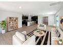 Spacious living room with modern decor, open floor plan, and access to the kitchen at 250 Marinna Joy Cir, Rockwell, NC 28138