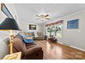 Bright living room featuring hardwood floors, neutral paint, and large windows at 300 Scotland Dr, Kings Mountain, NC 28086