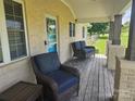 Inviting front porch with comfortable seating, enhancing the home's curb appeal and relaxation at 3100 Wallace Rd, Midland, NC 28107