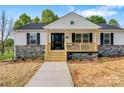 Attractive single-story home featuring a lovely front porch and meticulous landscaping at 3315 15Th Sw Ave, Hickory, NC 28602