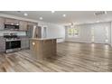 Open-concept kitchen with stainless steel appliances and a center island at 3315 15Th Sw Ave, Hickory, NC 28602