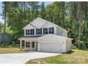 Beautiful two-story home with a two car garage, lovely black shutters, and a well manicured lawn at 601 Westway Dr, Gastonia, NC 28054