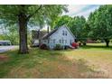 Large backyard with mature trees and greenery, offering a private outdoor space at 602 W 6Th St, Newton, NC 28658