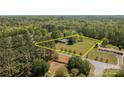 Aerial view of an estate surrounded by lush trees and a large lot at 6325 Yount Dr, Salisbury, NC 28147