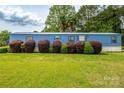 Charming one-story home featuring lush landscaping and a well-manicured lawn at 7041 Kays Dr, York, SC 29745