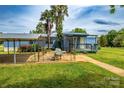 Inviting exterior view featuring a carport, covered patio, and manicured lawn at 7041 Kays Dr, York, SC 29745
