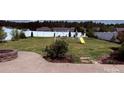 Spacious backyard with a white fence, swing set, and a stone fire pit at 79044 Ridgehaven Rd, Lancaster, SC 29720