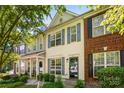 Charming townhouse with blue shutters, landscaping, and a well-maintained front yard at 8814 Gerren Ct, Charlotte, NC 28217
