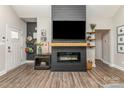 Living room with fireplace and TV, hardwood floors, and decorations at 135 Westerwood Dr, Rock Hill, SC 29732