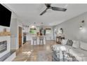 Open-concept living room seamlessly connecting to the kitchen with hardwood floors at 1420 Columbus St, Albemarle, NC 28001