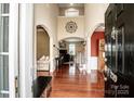 Elegant foyer with high ceilings, hardwood floors, and architectural details leading to living areas at 219 Pleasant Grove Ln, Mooresville, NC 28115