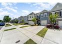 Street view of a row of townhomes with manicured lawns and ample parking in a well-maintained community at 314 Embers Ln, Clover, SC 29710