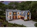 Beautiful two-story home with a spacious driveway, integrated garage, and manicured landscaping showcasing modern elegance at 3933 Ayrshire Pl, Charlotte, NC 28210