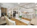Dining area with table, chairs and view to the kitchen and living room at 8326 Ramath Dr, Charlotte, NC 28211