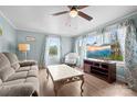 Cozy living room with ample natural light, hardwood floors, and comfortable seating at 127 Bristol Rd, Statesville, NC 28677