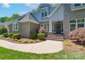 Inviting front entrance with beautiful landscaping and a charming walkway at 1959 Landry Ln, Rock Hill, SC 29732