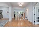 Bright hallway with hardwood floors, white trim, and open sight lines at 1959 Landry Ln, Rock Hill, SC 29732