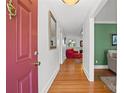 Inviting entryway with gleaming hardwood floors and a glimpse of the cozy living spaces at 2100 Stonewood Dr, Charlotte, NC 28210