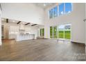 Bright living room featuring an open floorplan, hardwood floors, and lots of natural light at 6712 Cove Ln, Sherrills Ford, NC 28673
