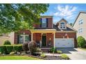 Charming two-story brick home with black shutters and a well-manicured lawn at 8004 Fountainbrook Dr # 15, Indian Trail, NC 28079