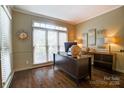 Home office with a large window and wood floors at 10319 Remembrance Trl, Huntersville, NC 28078