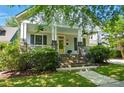 Charming home with a welcoming porch, brick stairs, and a well-manicured front yard at 1038 Gardenia St, Fort Mill, SC 29708