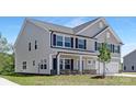 Charming two-story home featuring gray siding, black shutters, and a two-car garage at 111 Stonewater Dr # 25, Red Cross, NC 28129