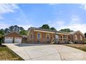 Home exterior shot with a two-car garage and long driveway at 124 Hunters Creek Dr, Mooresville, NC 28115