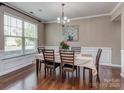 Cozy dining room with a large window, chandelier, and elegant table setting at 140 Halifax Dr, Fort Mill, SC 29707
