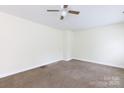 Spacious carpeted bedroom featuring a ceiling fan and neutral decor at 166 Still Ave, Fort Mill, SC 29715