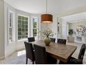 Bright dining room featuring a wooden table, seating for six, and large windows offering ample natural light at 2544 Barrington Ct, Rock Hill, SC 29732