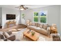 Bright living room with hardwood floors, large window, and comfortable furnishings at 269 Bud Black Rd, Crouse, NC 28033
