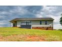 Home's backyard featuring a small deck and vinyl siding at 301 Walkers Ridge Dr, Shelby, NC 28152