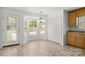 Eat-in kitchen with bay window, tile floor, and closet at 318 Huffman Rd, Gastonia, NC 28056