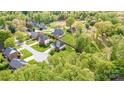 A residential area showcasing well-manicured lawns and diverse home styles nestled among mature trees at 3837 1St Street Nw Ln, Hickory, NC 28601
