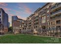 Exterior view of a building overlooking the terrace with a steel arbor at 400 N Church St # 413, Charlotte, NC 28202