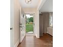 Welcoming foyer with hardwood floors, a view to the yard, and seamless transition to living spaces at 4346 Walker Rd, Charlotte, NC 28211