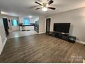 Inviting living room featuring wood flooring and an open layout to the modern kitchen at 440 Mt Moriah Church Rd, China Grove, NC 28023