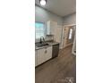 Well-lit kitchen with stainless steel appliances, light countertops, and modern fixtures at 567 5Th St, Chester, SC 29706