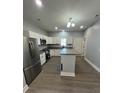 Modern kitchen with stainless steel appliances, gray countertops, and white cabinets at 567 5Th St, Chester, SC 29706