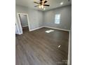 Bright living room with sleek flooring, fresh paint, and ample natural light from the window at 567 5Th St, Chester, SC 29706