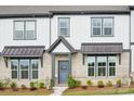 Attractive brick and vinyl townhome with covered entry and landscaped yard at 5712 Runnel Way, Charlotte, NC 28215