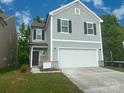 Beautiful two-story home featuring a two-car garage and a manicured lawn at 756 Gondola Ct # 127, Salisbury, NC 28144