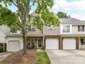 Charming townhome with a well-maintained lawn, attached garage and a welcoming front porch at 9723 Mattforest Cir, Charlotte, NC 28277