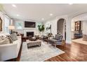 Bright living room with hardwood floors, fireplace, and stylish furniture at 2246 Sharon Rd, Charlotte, NC 28207