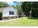 Inviting single Gathering home with a lush lawn, front porch, and decorative palm tree at 432 Partridge Pl, York, SC 29745