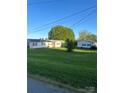 Expansive backyard featuring a detached garage and lush greenery at 543 18Th Nw St, Hickory, NC 28601