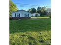 Spacious backyard featuring a well-maintained lawn and detached garage at 543 18Th Nw St, Hickory, NC 28601