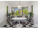 Sunlit breakfast nook featuring built-in bench seating, large windows, and stylish decor at 1025 Ardsley Rd # 103, Charlotte, NC 28207