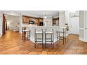 Kitchen featuring a breakfast bar with seating and wooden cabinets at 1200 Churchill Downs Dr, Waxhaw, NC 28173